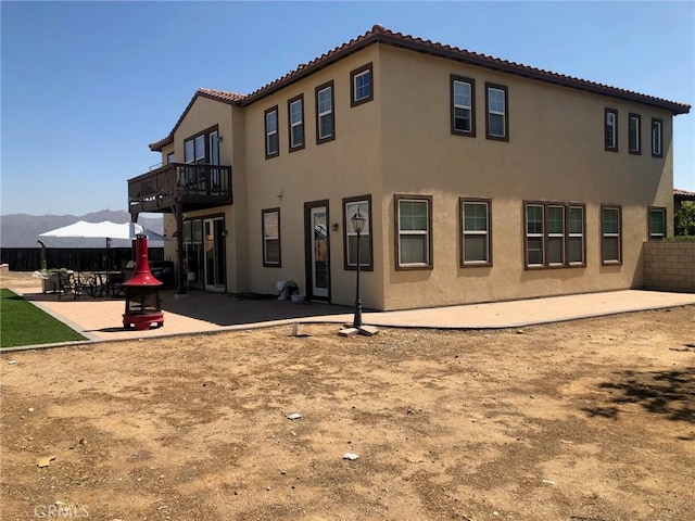 20800 Indigo, Riverside, CA 92508 - rear view of property featuring stucco siding, a tiled roof, and a patio