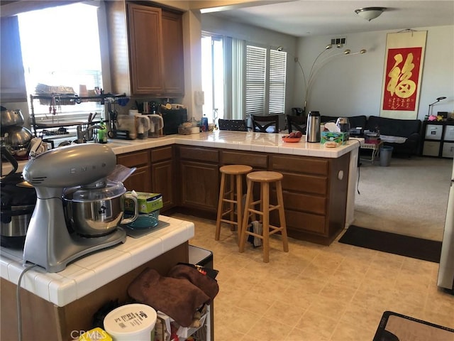 20800 Indigo, Riverside, CA 92508 - kitchen with tile countertops, a peninsula, and open floor plan