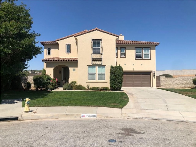 20800 Indigo, Riverside, CA 92508 - mediterranean / spanish-style house with driveway, a tile roof, an attached garage, a front lawn, and stucco siding