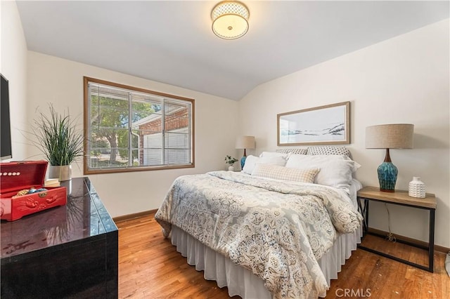 7021 Shoshone Ave, Lake Balboa, CA 91406 - bedroom with wood finished floors and lofted ceiling