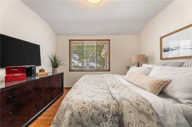 7021 Shoshone Ave, Lake Balboa, CA 91406 - bedroom featuring vaulted ceiling and wood finished floors