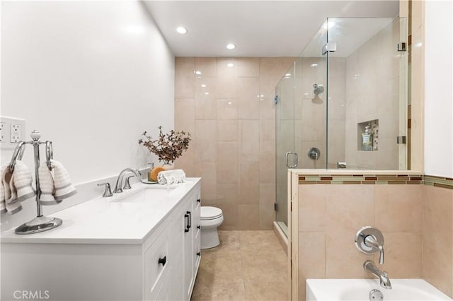 7021 Shoshone Ave, Lake Balboa, CA 91406 - bathroom with a stall shower, a bath, recessed lighting, vanity, and tile patterned flooring