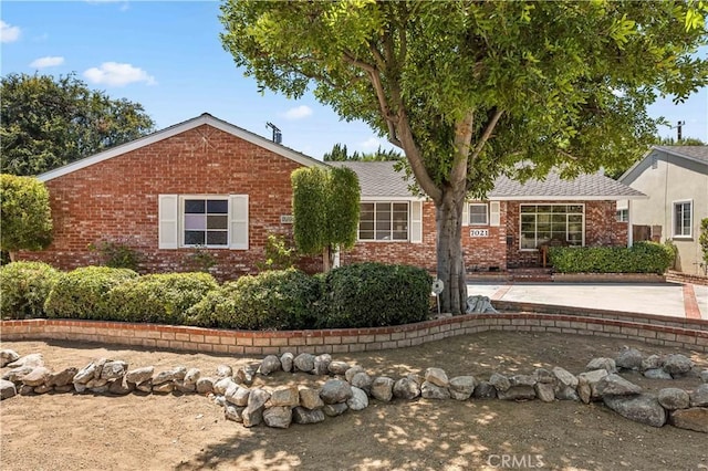7021 Shoshone Ave, Lake Balboa, CA 91406 - view of front of house featuring brick siding