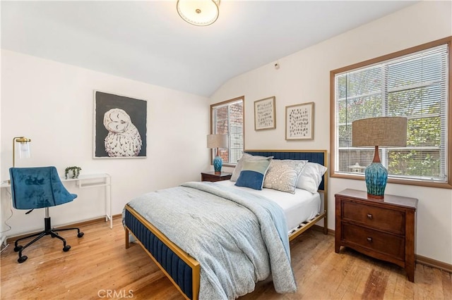 7021 Shoshone Ave, Lake Balboa, CA 91406 - bedroom featuring wood finished floors and vaulted ceiling