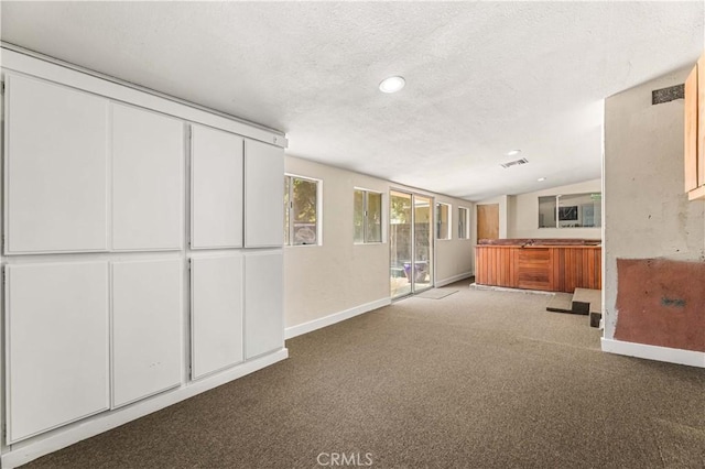 7021 Shoshone Ave, Lake Balboa, CA 91406 - kitchen with a textured ceiling, carpet floors, lofted ceiling, white cabinets, and recessed lighting