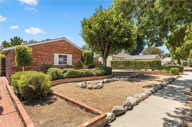 7021 Shoshone Ave, Lake Balboa, CA 91406 - view of front of house featuring brick siding