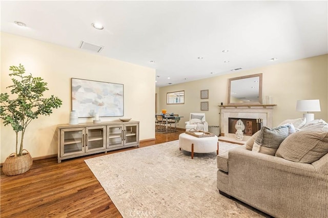7021 Shoshone Ave, Lake Balboa, CA 91406 - living area featuring wood finished floors, a fireplace, and recessed lighting