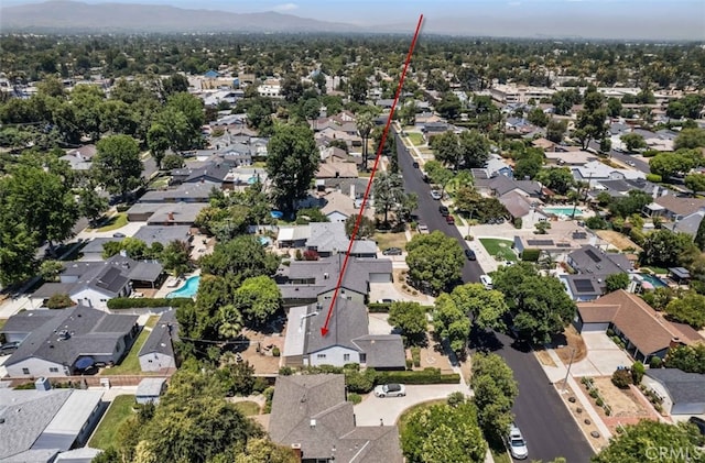 7021 Shoshone Ave, Lake Balboa, CA 91406 - aerial view of property and surrounding area with nearby suburban area and a mountain backdrop