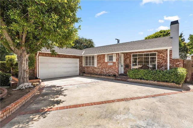 7021 Shoshone Ave, Lake Balboa, CA 91406 - single story home featuring brick siding, an attached garage, driveway, and a chimney