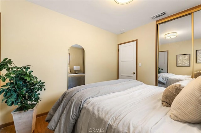 7021 Shoshone Ave, Lake Balboa, CA 91406 - bedroom with wood finished floors and arched walkways