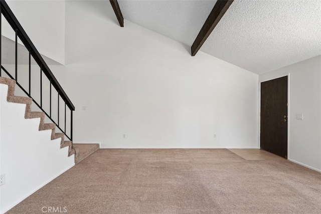 6150 Montecito Dr Unit 6, Palm Springs, CA 92264 - unfurnished living room featuring carpet flooring, stairs, and a textured ceiling