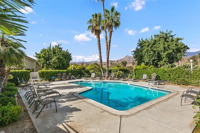 6150 Montecito Dr Unit 6, Palm Springs, CA 92264 - community pool featuring a patio area and a mountain view