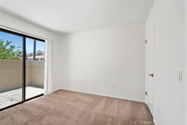 6150 Montecito Dr Unit 6, Palm Springs, CA 92264 - carpeted spare room with a textured ceiling and baseboards