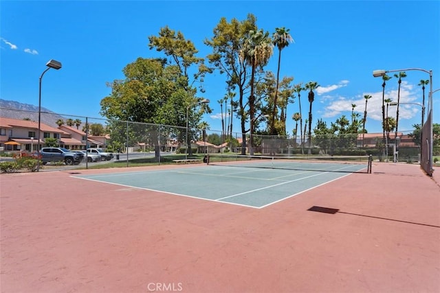 6150 Montecito Dr Unit 6, Palm Springs, CA 92264 - view of tennis court featuring community basketball court