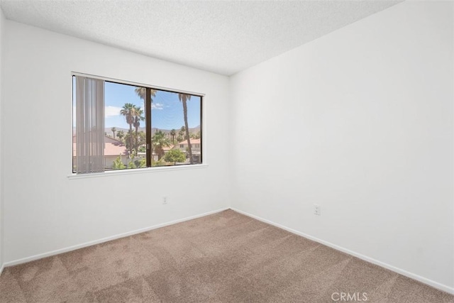 6150 Montecito Dr Unit 6, Palm Springs, CA 92264 - unfurnished room with carpet floors and a textured ceiling