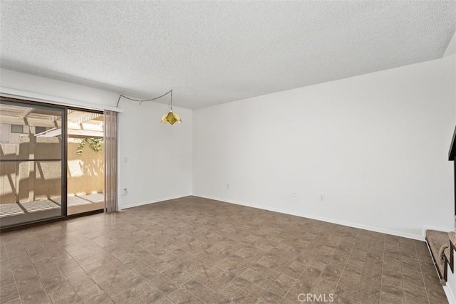 6150 Montecito Dr Unit 6, Palm Springs, CA 92264 - empty room featuring a textured ceiling and baseboards