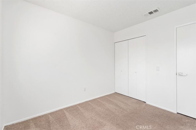 6150 Montecito Dr Unit 6, Palm Springs, CA 92264 - unfurnished bedroom with carpet flooring and a closet