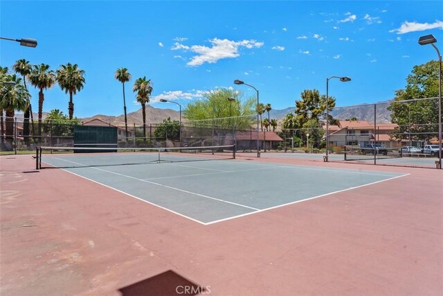 6150 Montecito Dr Unit 6, Palm Springs, CA 92264 - view of tennis court with a mountain view and community basketball court