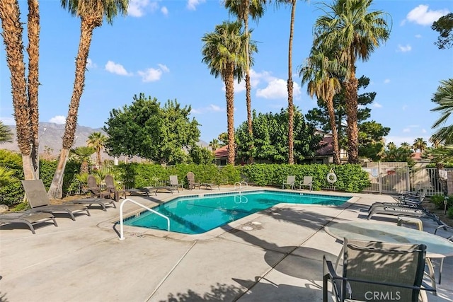 6150 Montecito Dr Unit 6, Palm Springs, CA 92264 - community pool featuring a patio area and a mountain view