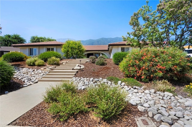 9430 Valley View St, Rancho Cucamonga, CA 91737 - view of front of property with a tiled roof, stucco siding, a mountain view, and stairs