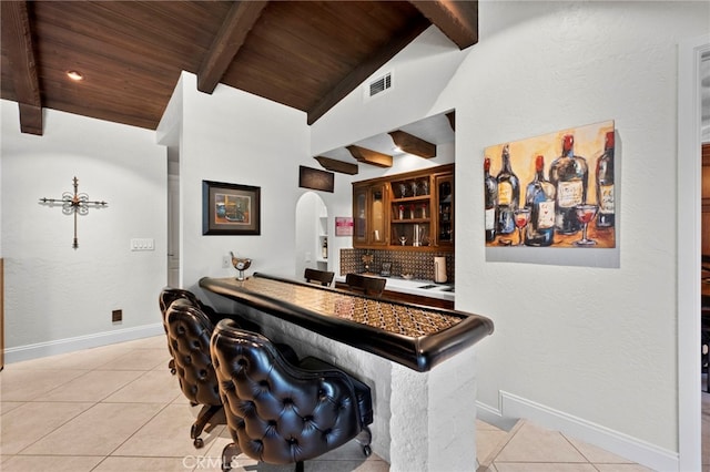 9430 Valley View St, Rancho Cucamonga, CA 91737 - indoor bar featuring light tile patterned flooring, wooden ceiling, arched walkways, and tasteful backsplash