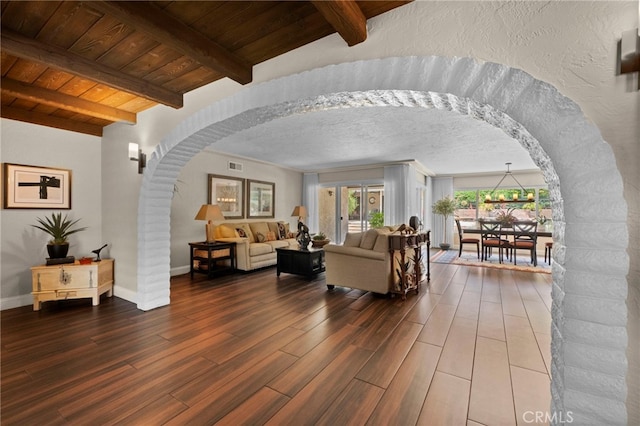 9430 Valley View St, Rancho Cucamonga, CA 91737 - living area with arched walkways, plenty of natural light, wood finished floors, and beam ceiling