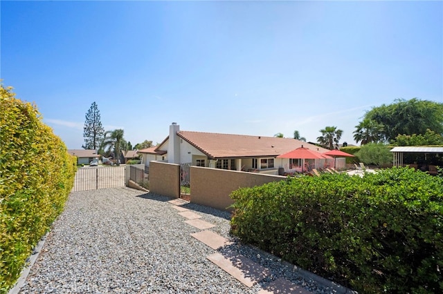 9430 Valley View St, Rancho Cucamonga, CA 91737 - view of property exterior with a gate and a gazebo