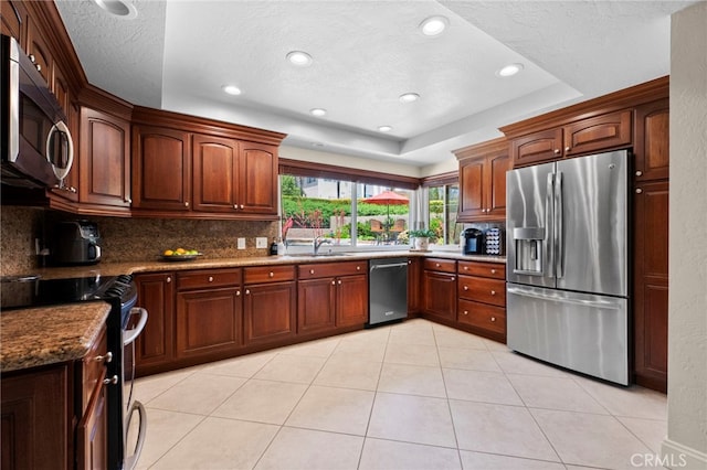 9430 Valley View St, Rancho Cucamonga, CA 91737 - kitchen featuring stainless steel appliances, decorative backsplash, recessed lighting, light tile patterned floors, and a textured ceiling