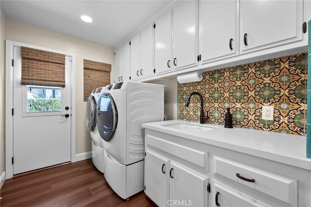 9430 Valley View St, Rancho Cucamonga, CA 91737 - laundry area featuring washer and clothes dryer, cabinet space, dark wood-style flooring, and recessed lighting