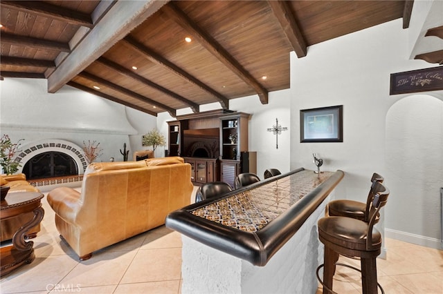 9430 Valley View St, Rancho Cucamonga, CA 91737 - bar area featuring wooden ceiling, light tile patterned flooring, and a fireplace with raised hearth