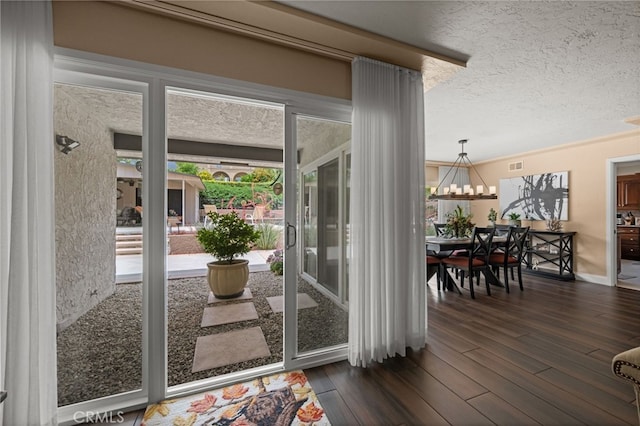 9430 Valley View St, Rancho Cucamonga, CA 91737 - entryway featuring dark wood-style floors, a textured ceiling, and a chandelier