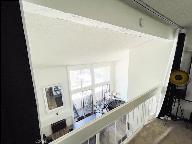 5310 Zelzah Ave Unit 312, Encino, CA 91316 - hallway featuring carpet, an upstairs landing, and a textured ceiling