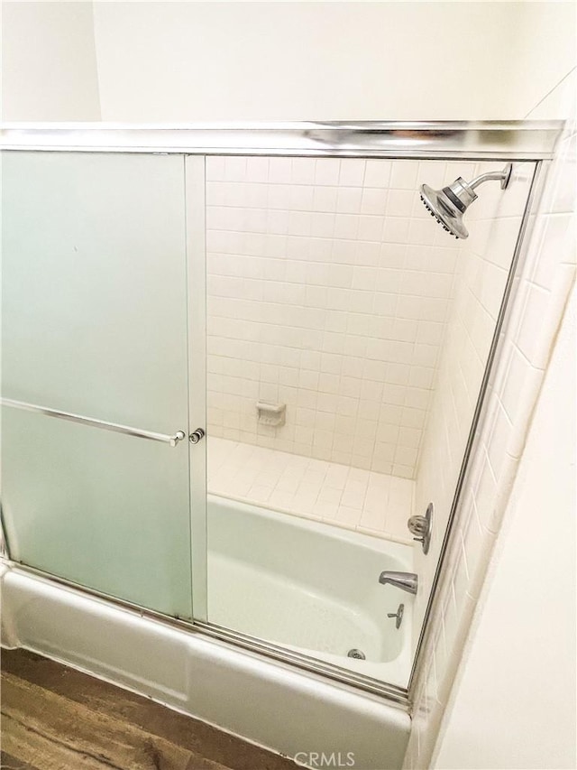 5310 Zelzah Ave Unit 312, Encino, CA 91316 - bathroom with bath / shower combo with glass door and wood finished floors