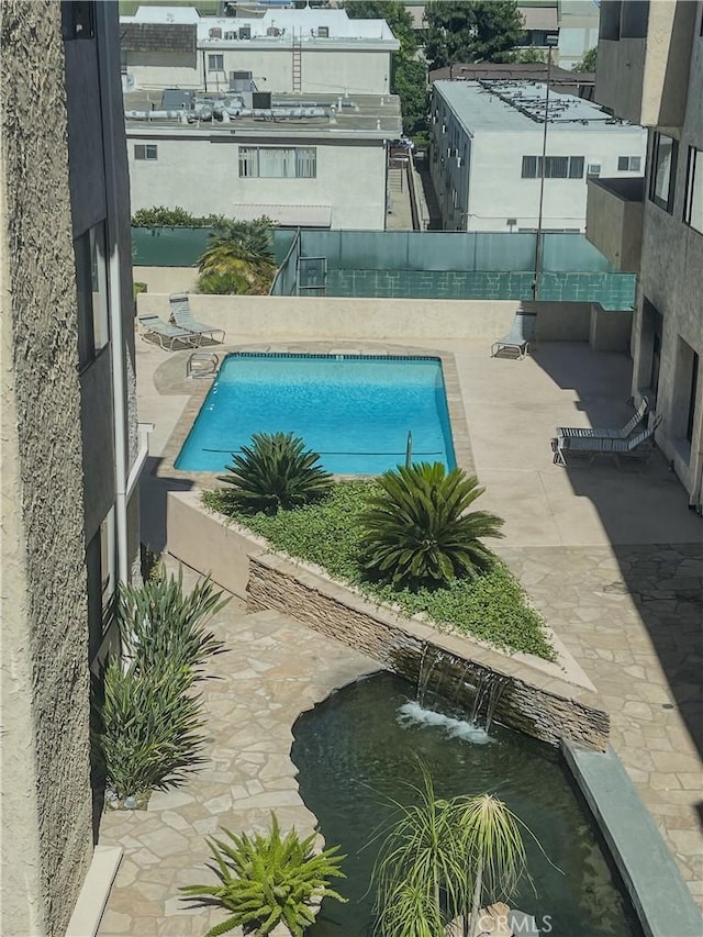 5310 Zelzah Ave Unit 312, Encino, CA 91316 - community pool with a patio and a fenced backyard