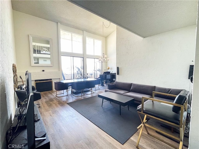 5310 Zelzah Ave Unit 312, Encino, CA 91316 - living area with a textured wall, wood finished floors, and a textured ceiling