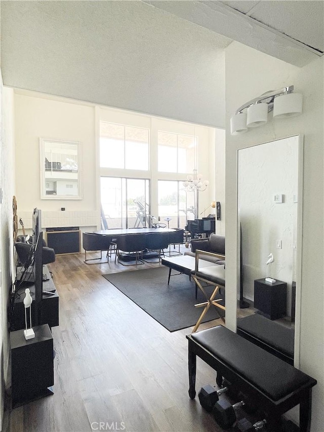 5310 Zelzah Ave Unit 312, Encino, CA 91316 - living area featuring wood finished floors and a chandelier