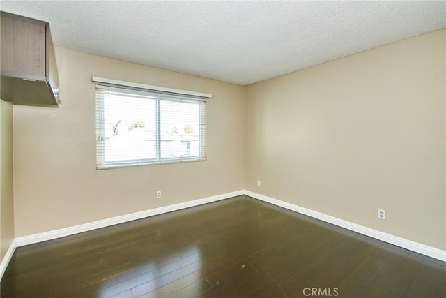 1116 Cleghorn Dr Unit B, Diamond Bar, CA 91765 - empty room featuring dark wood finished floors and a textured ceiling