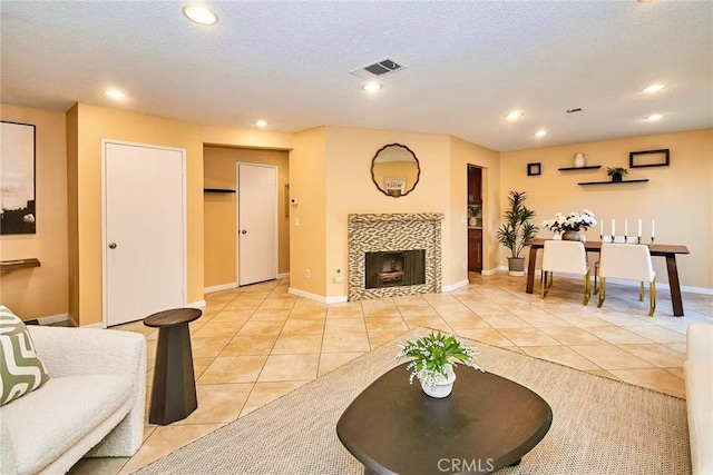 1116 Cleghorn Dr Unit B, Diamond Bar, CA 91765 - living room featuring light tile patterned floors, a fireplace, recessed lighting, and a textured ceiling