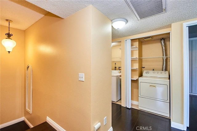 1116 Cleghorn Dr Unit B, Diamond Bar, CA 91765 - laundry room featuring a textured ceiling, dark wood finished floors, and washing machine and clothes dryer