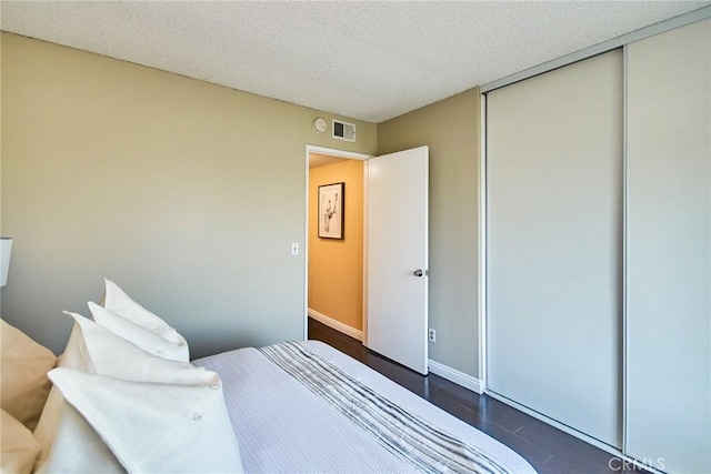 1116 Cleghorn Dr Unit B, Diamond Bar, CA 91765 - bedroom featuring a closet, a textured ceiling, and dark wood-type flooring