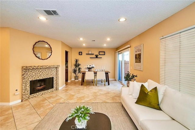 1116 Cleghorn Dr Unit B, Diamond Bar, CA 91765 - living area with light tile patterned floors, recessed lighting, a textured ceiling, and a tile fireplace