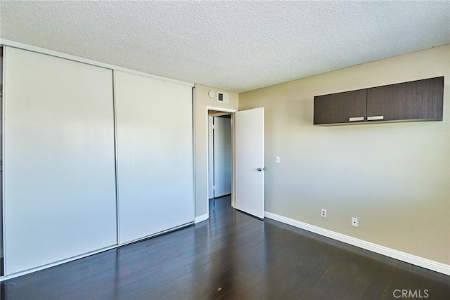 1116 Cleghorn Dr Unit B, Diamond Bar, CA 91765 - unfurnished bedroom featuring dark wood-style flooring, a closet, and a textured ceiling