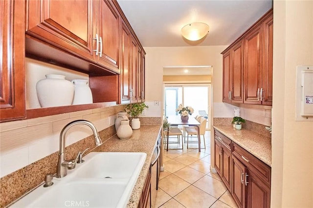1116 Cleghorn Dr Unit B, Diamond Bar, CA 91765 - kitchen with light tile patterned floors, brown cabinetry, and light stone counters