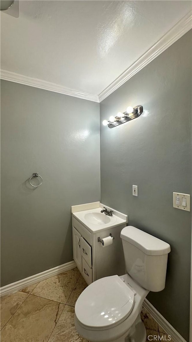 9206 Elizabeth Ave, South Gate, CA 90280 - half bathroom with crown molding, vanity, and tile patterned flooring