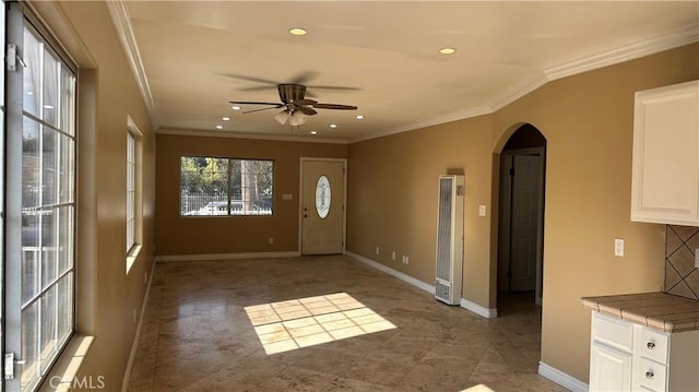 9206 Elizabeth Ave, South Gate, CA 90280 - foyer entrance with a heating unit, arched walkways, ceiling fan, ornamental molding, and recessed lighting