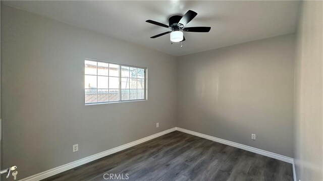 9206 Elizabeth Ave, South Gate, CA 90280 - unfurnished room featuring dark wood-style flooring and a ceiling fan