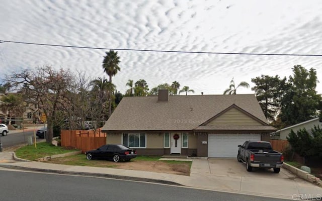 1507 Greenfield Dr, El Cajon, CA 92021 - single story home with driveway, an attached garage, a chimney, and roof with shingles