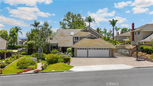 21210 Twin Oak, Yorba Linda, CA 92886 - traditional-style house featuring driveway, a gate, and a garage