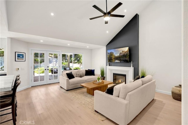 21210 Twin Oak, Yorba Linda, CA 92886 - living room with french doors, light wood-style flooring, recessed lighting, a glass covered fireplace, and a ceiling fan