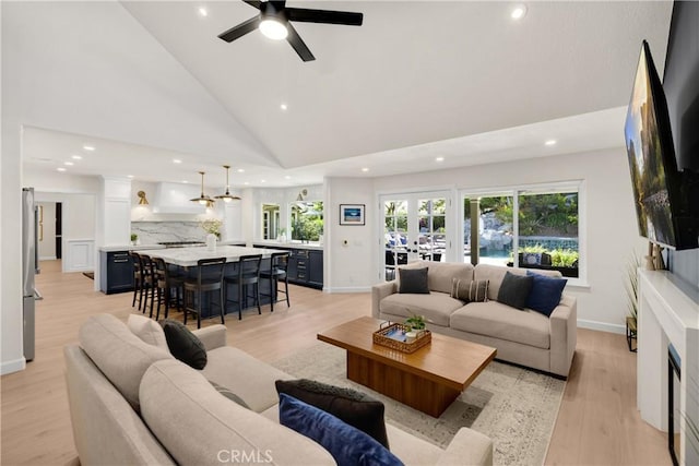 21210 Twin Oak, Yorba Linda, CA 92886 - living room featuring recessed lighting, light wood finished floors, high vaulted ceiling, ceiling fan, and a high end fireplace